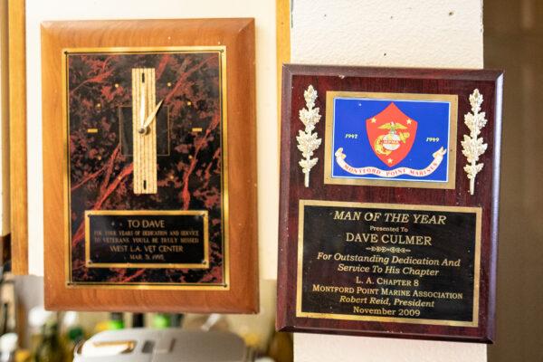 Awards given to United States Marine Corp. Veteran Dave Culmer hang at his home in Culver City, Calif., on June 13, 2021. (John Fredricks/The Epoch Times)