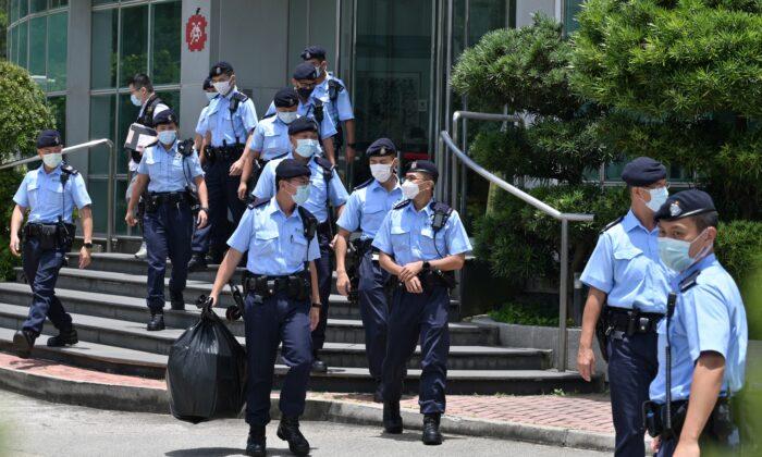 Hong Kong Police Raid Newsroom of Pro-Democracy Paper, Arrest Executives