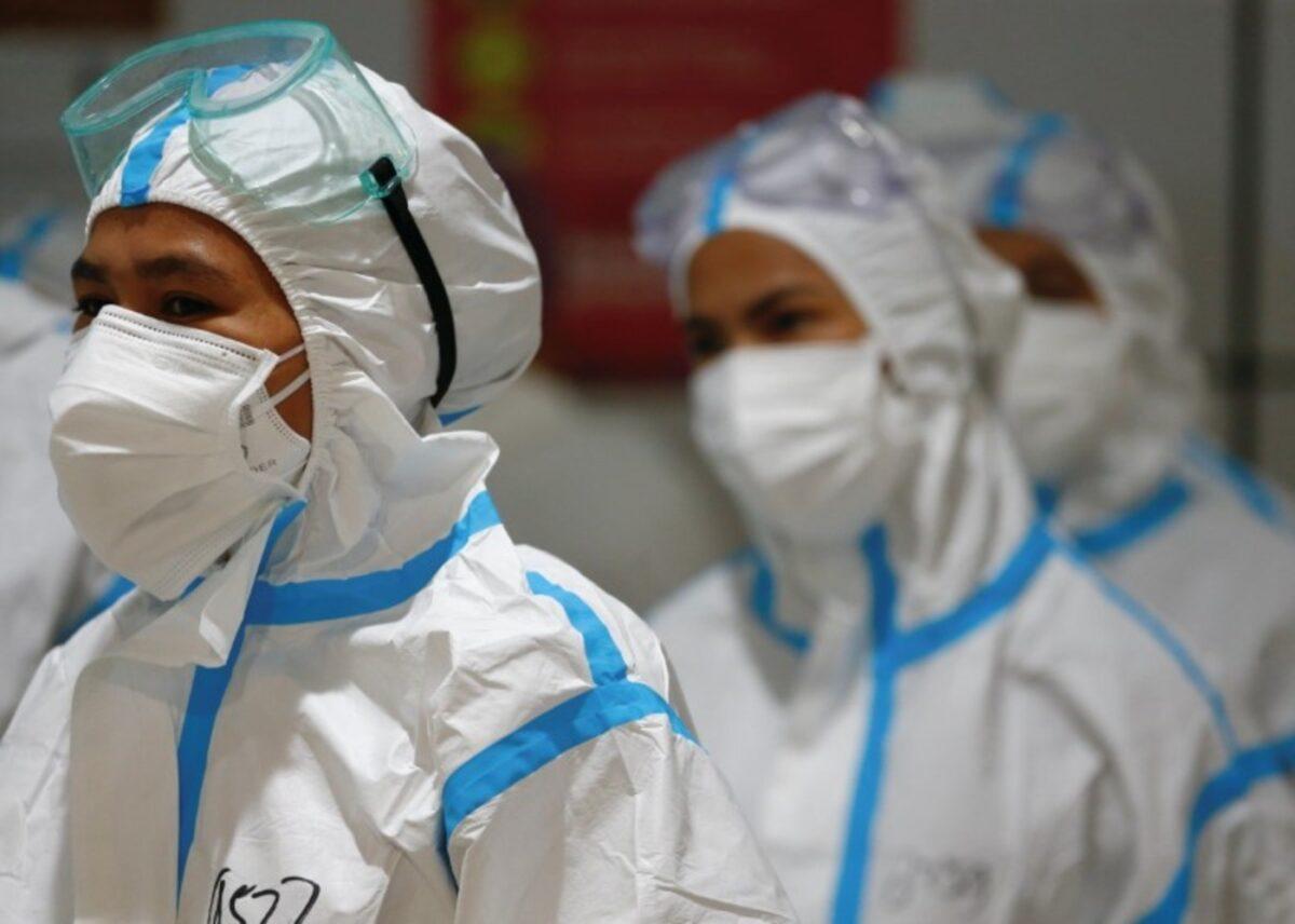 Healthcare workers wearing PPE (personal protective equipment) get ready to treat patients at the emergency hospital for COVID-19 in Jakarta, Indonesia, on June 17, 2021. (Ajeng Dinar Ulfiana/Reuters)