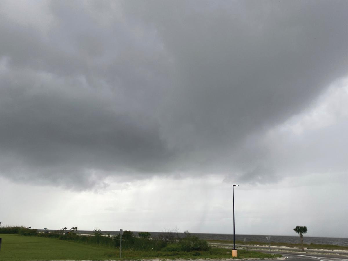 Clouds from potential Tropical Storm Claudette form on Highway 90 Beaches in Pass Christian, Miss., on June 18, 2021. (Hunter Dawkins/The Gazebo Gazette via AP)