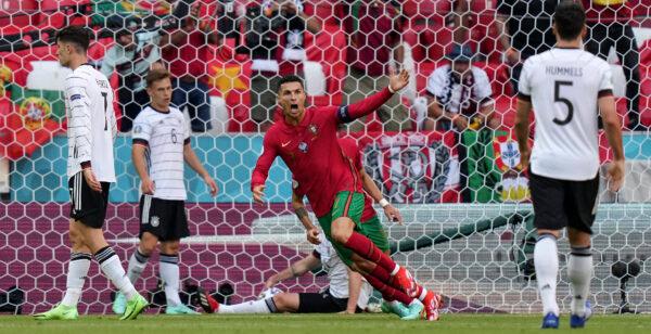 Portugal's Cristiano Ronaldo celebrates after scoring the opening goal during the Euro 2020 soccer championship group F match between Portugal and Germany in Munich, Germany, on June 19, 2021. (Matthias Schrader/Pool/AP Photo)