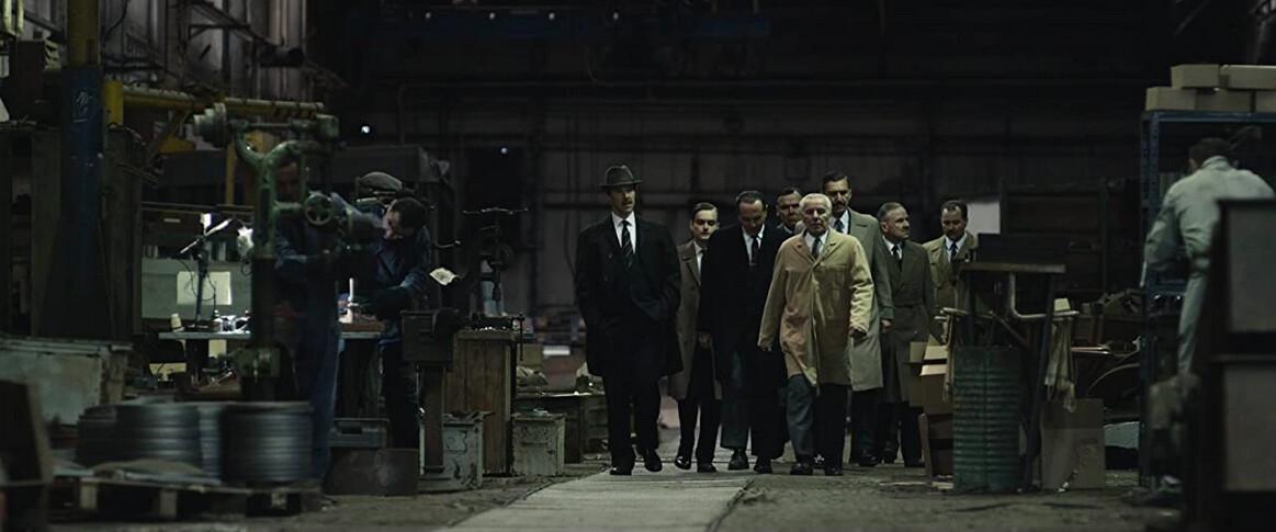 Greville Wynne (Benedict Cumberbatch, L) with Russian businessmen in “The Courier.” (Liam Daniel/Roadside Attractions)