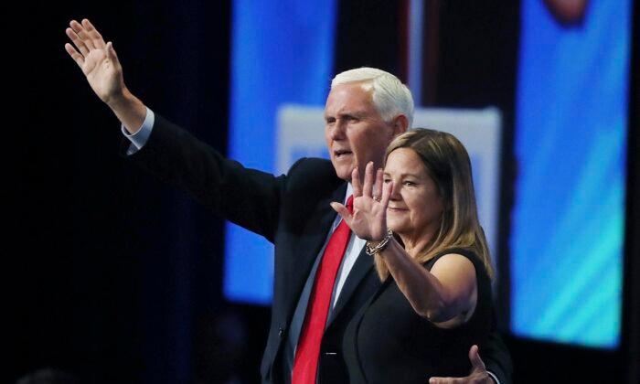 Former Vice President Mike Pence and Second Lady Karen Pence wave to attendees at the Road to Majority convention in Kissimmee, Fla., on June 18, 2021. (Stephen M. Dowell/Orlando Sentinel via AP)