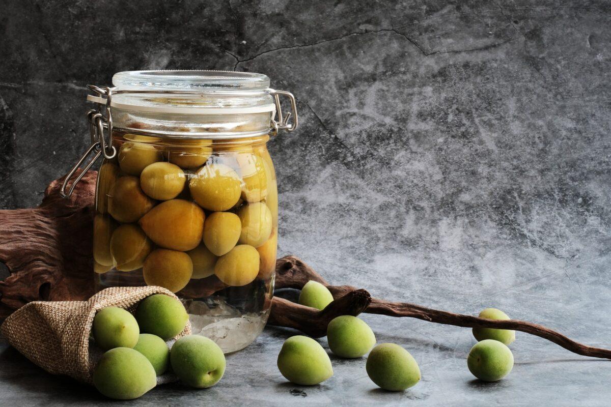 Umeshu requires patience: The fruit, liquor, and sugar must sit for at least six months before being ready to enjoy. (Factory X/Shutterstock)