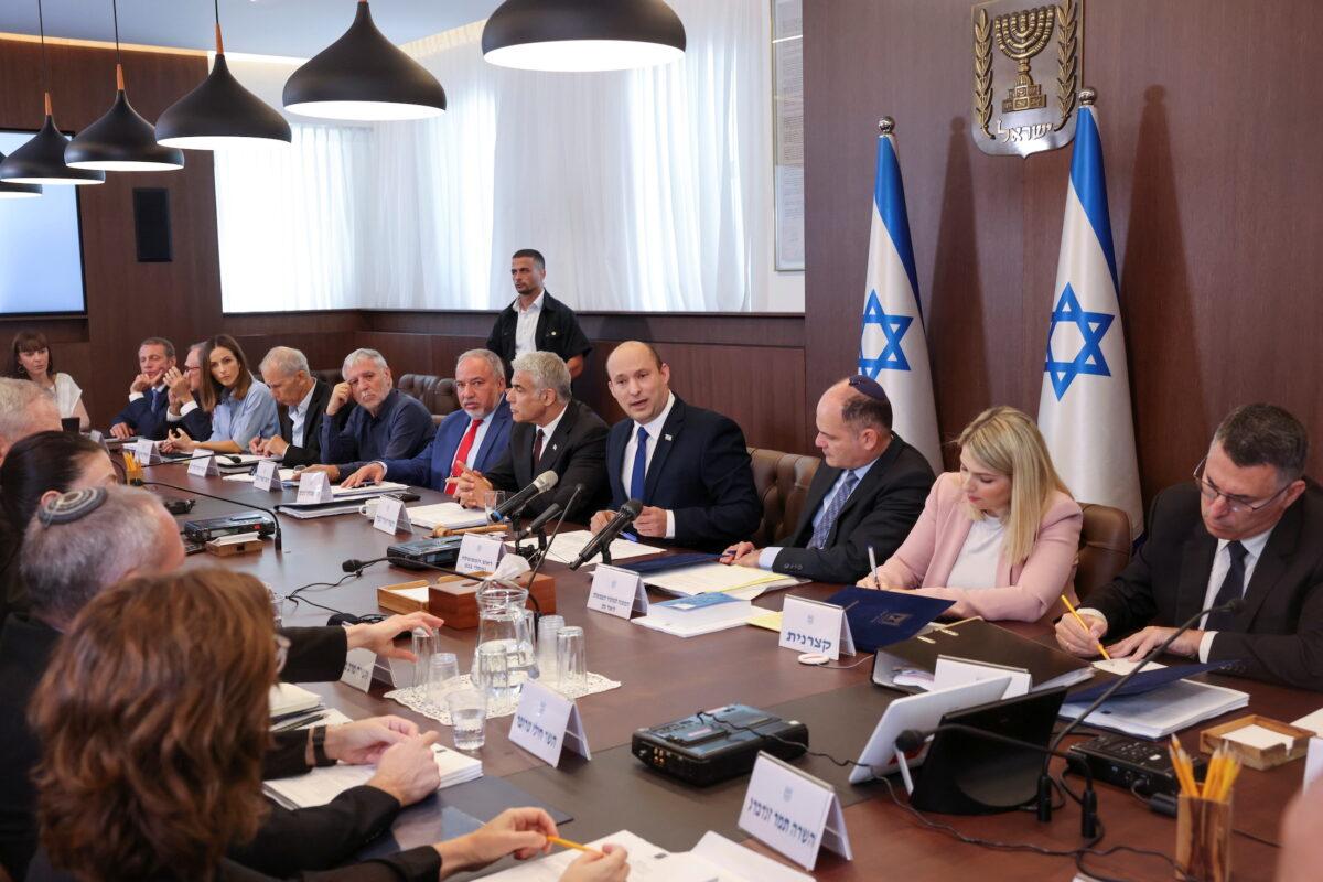 Israeli Prime Minister Naftali Bennett chairs the first weekly cabinet meeting of his new government in Jerusalem, on June 20, 2021. (Emmanuel Dunand/Pool via Reuters)