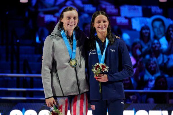 Katie Ledecky and Katie Grimes on the podium at the medal ceremony for the women's 800 freestyle during wave 2 of the U.S. Olympic Swim Trials in Omaha, Neb., on June 19, 2021. (Charlie Neibergall/AP Photo)