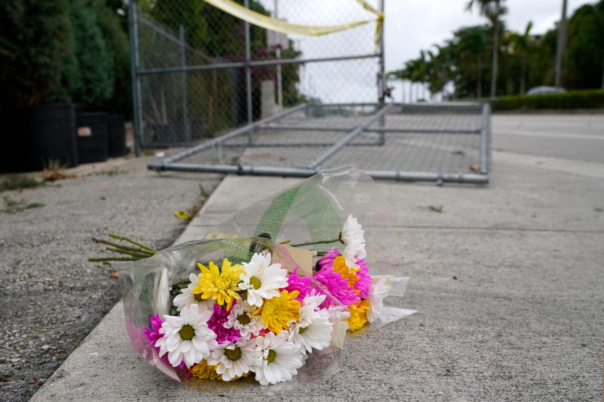Flowers lie at the scene where a driver slammed into spectators at the start of a gay pride parade in Fort Lauderdale, Fla., on June 20, 2021. (Lynne Sladky/AP Photo)