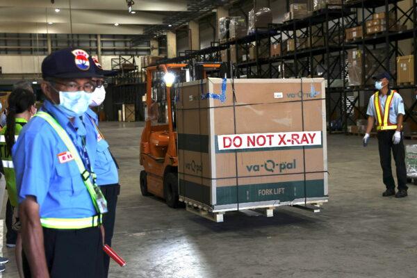 A forklift is used to transport Moderna vaccines against the coronavirus disease at Taiwan Air cargo Terminal in Taoyuan, Taiwan, on June 18, 2021. (Ann Wang/File Photo/Reuters)