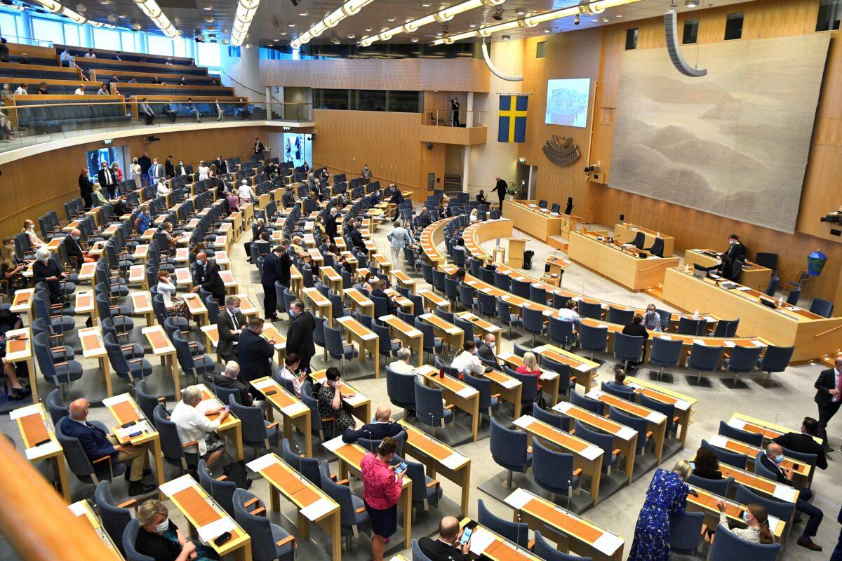 Swedish parliament members arrive for the no-confidence vote against Prime Minister Stefan Lofven, in Stockholm, on June 21, 2021. (TT News Agency/Claudio Bresciani via Reuters)