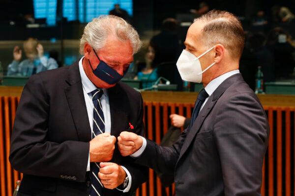 Luxembourg's Foreign Minister Jean Asselborn, left, greets German's Foreign Minister Heiko Maas during a European Foreign Affairs Ministers meeting at the European Council building in Luxembourg, on June 21, 2021. (Johanna Geron/Pool Photo via AP)