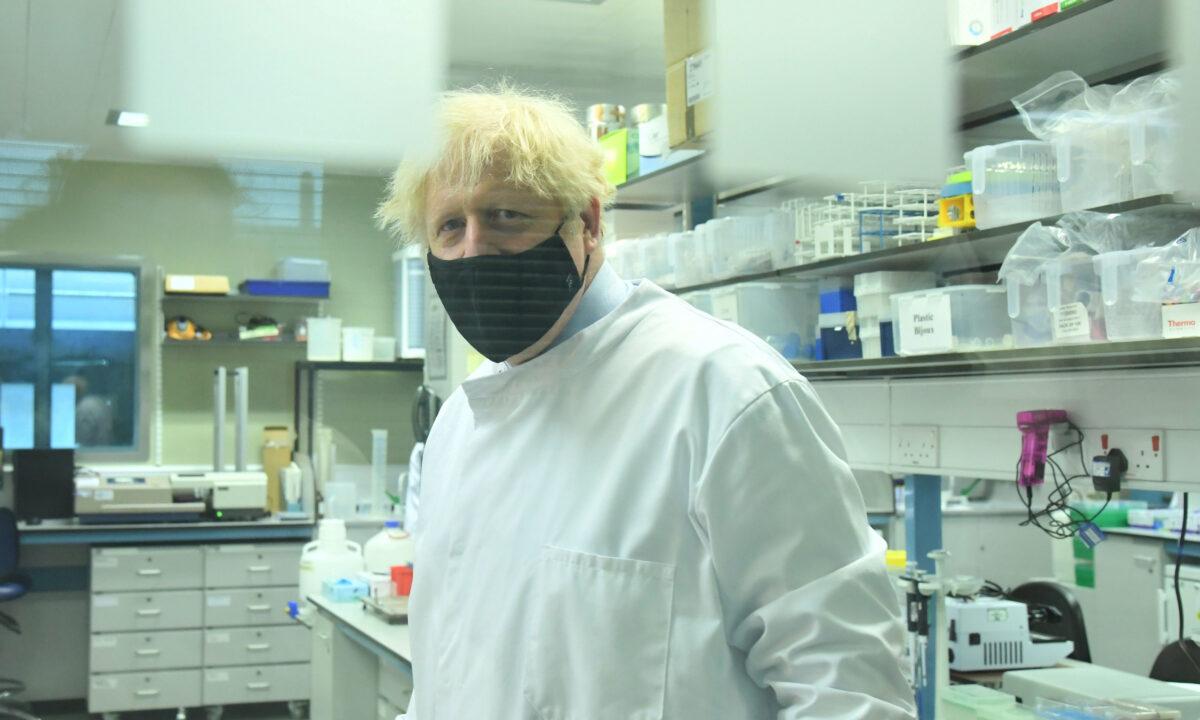 Prime Minister Boris Johnson during a visit to the National Institute for Biological Standards in South Mimms, Hertfordshire, England on June 21, 2021. (Jeremy Selwyn/Evening Standard via PA)