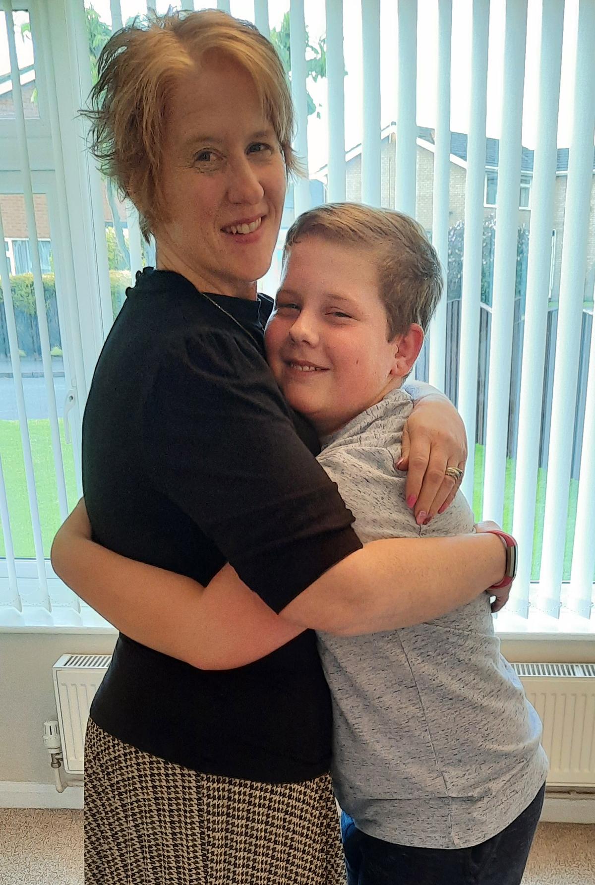 Sarah Stanley with her son after losing weight. (Caters News)