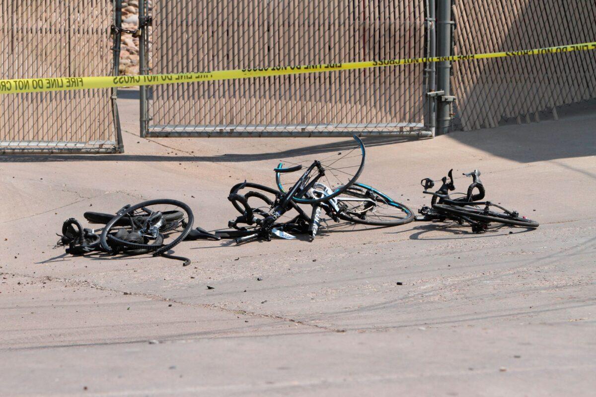 This Saturday, June 19, 2021, photo courtesy of The White Mountain Independent shows the scene of an accident with broken bicycles in Show Low, Ariz. (Jim Headley/The White Mountain Independent via AP)
