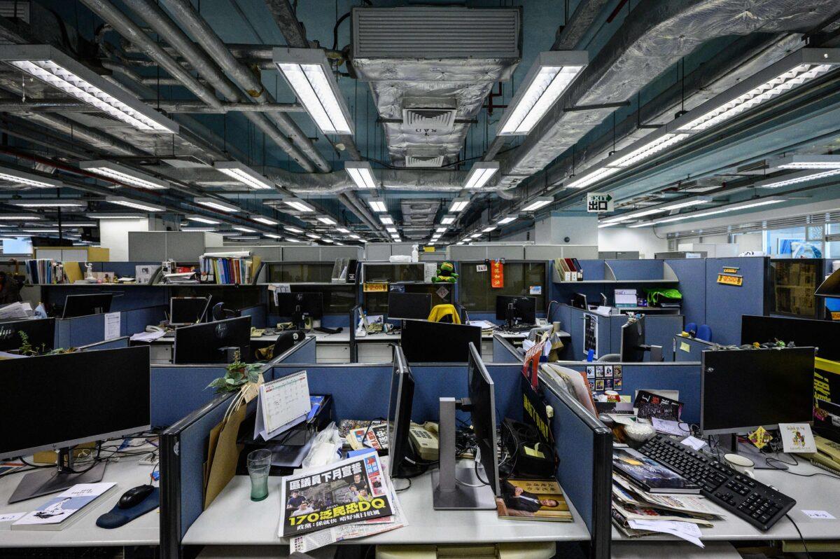 Monitors are seen detached from desktop computers at the Apple Daily political desk, after they were taken away as evidence from the local paper's newsroom in Hong Kong on June 17, 2021. (Anthony Wallace/AFP via Getty Images)