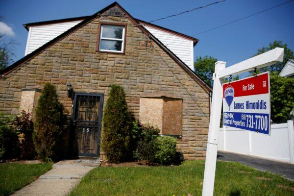 A "for sale" sign is seen outside a single family house in Garden City, New York, U.S., on May 23, 2016. (Shannon Stapleton/Reuters)