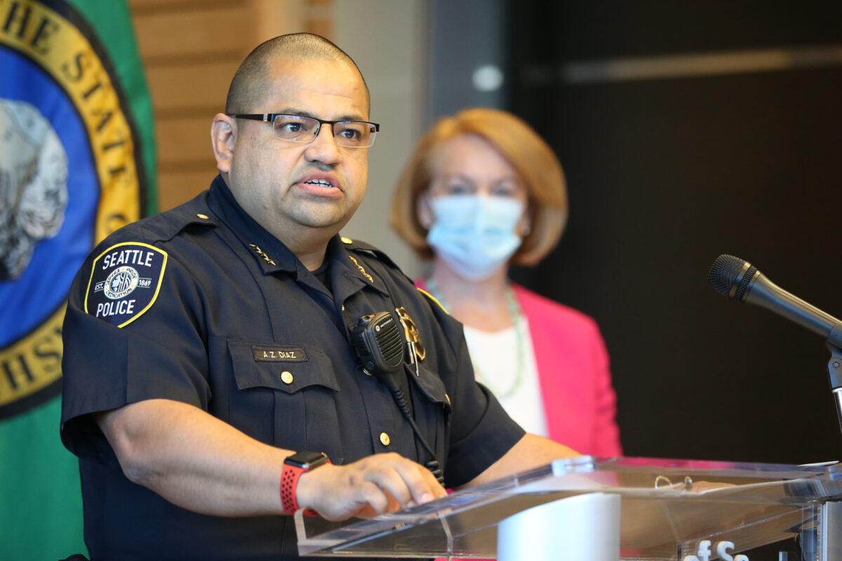 Adrian Diaz, Deputy Chief of Seattle Police speaks at a press conference as Seattle Mayor Jenny Durkan (R) looks on at Seattle City Hall, in Seattle, Wash., on Aug. 11, 2020. (Karen Ducey/Getty Images)