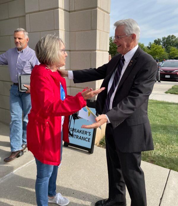Former state Senator Dick Black (right) spoke to a supporter outside of the Loudoun County Public School Administration Building on June 22. (Terri Wu/The Epoch Times)