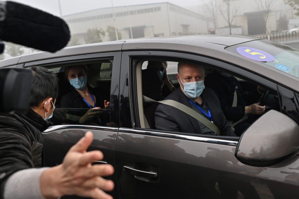 Peter Daszak (R) and other members of the World Health Organization (WHO) team investigating the origins of the COVID-19 coronavirus arrive at the Wuhan Institute of Virology in Wuhan in China's central Hubei province on Feb. 3, 2021. (Hector Retamal/AFP via Getty Images)