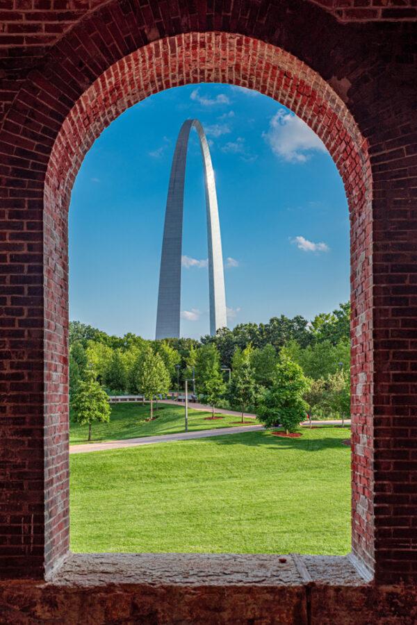 The Gateway Arch, seen through a brick window frame. (RozenskiP/Shutterstock)