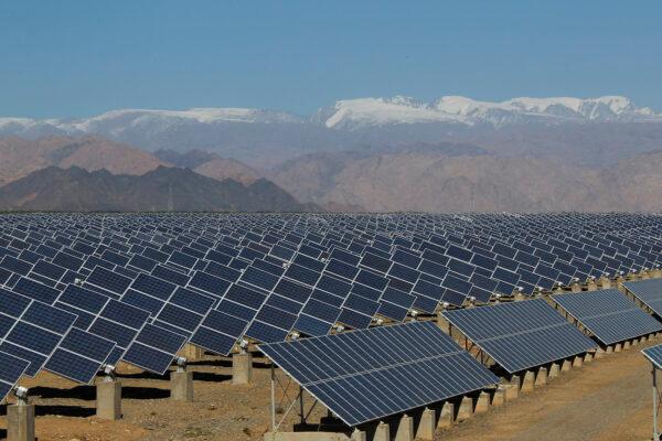 Large solar panels in a solar power plant in Hami, northwest China's Xinjiang Autonomous Region on May 8, 2013. (STR/AFP via Getty Images)