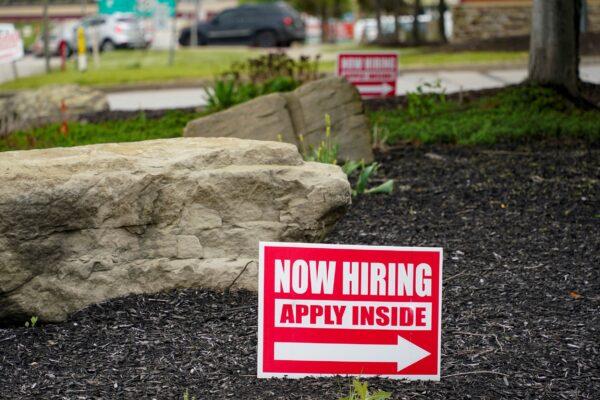 Hiring signs posted outside a gas station in Cranberry Township, Butler County, Pa., on May 5, 2021. (Keith Srakocic/AP Photo)