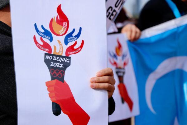 Panels held up by protesters at the "No Beijing 2022" rally in Melbourne, Australia, on June 23, 2021. (The Epoch Times)