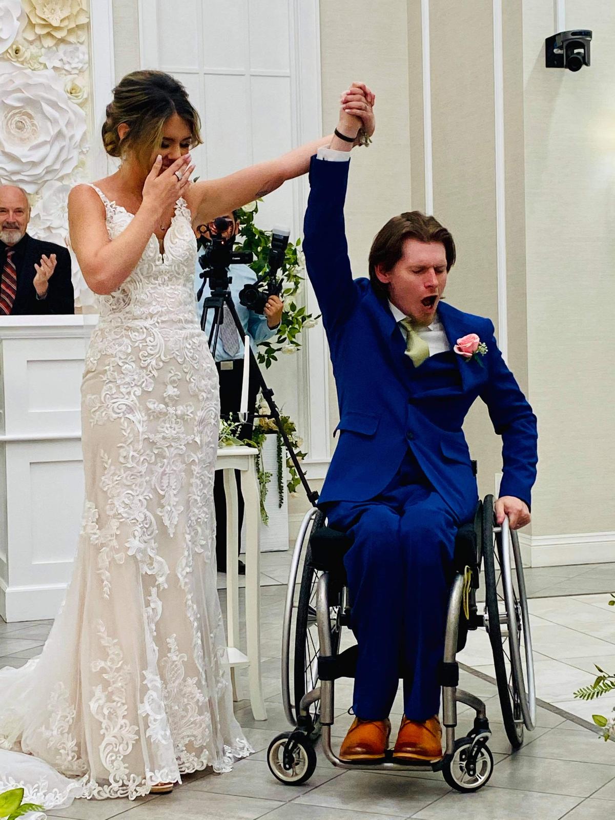 Ryan Estep and Chandler Dendy Estep celebrating their wedding moment when they were pronounced husband and wife. (Courtesy of <a href="https://www.instagram.com/estep_2012/">Ryan Estep</a>)