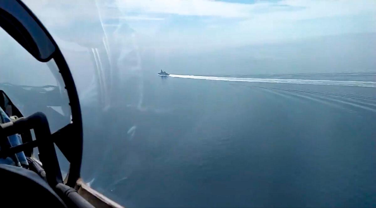 In this grab taken from a video released by the Russian Defense Ministry Press Service, a view of the British destroyer HMS Defender as it sails near Crimea in the Black Sea, on June 23, 2021. (Russian Defense Ministry Press Service via AP)