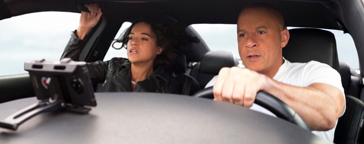 Michelle Rodriguez and Vin Diesel do some supernormal driving in “F9: The Fast Saga.” (Giles Keyte/Universal)