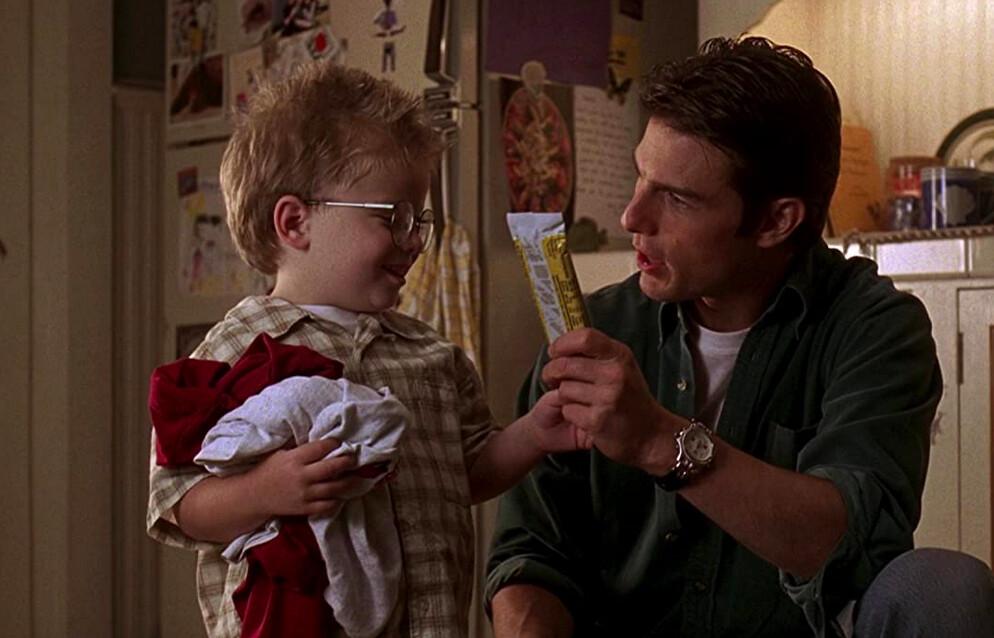Jerry Maguire (Tom Cruise, R) offering Ray Boyd (Jonathan Lipnicki) a protein bar that will keep him up all night, in “Jerry Maguire.” (TriStar Pictures)