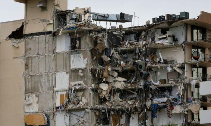 Rubble hangs from a partially collapsed building in Surfside north of Miami Beach, Fla., on June 24, 2021. (Eva Marie Uzcategui/AFP via Getty Images)