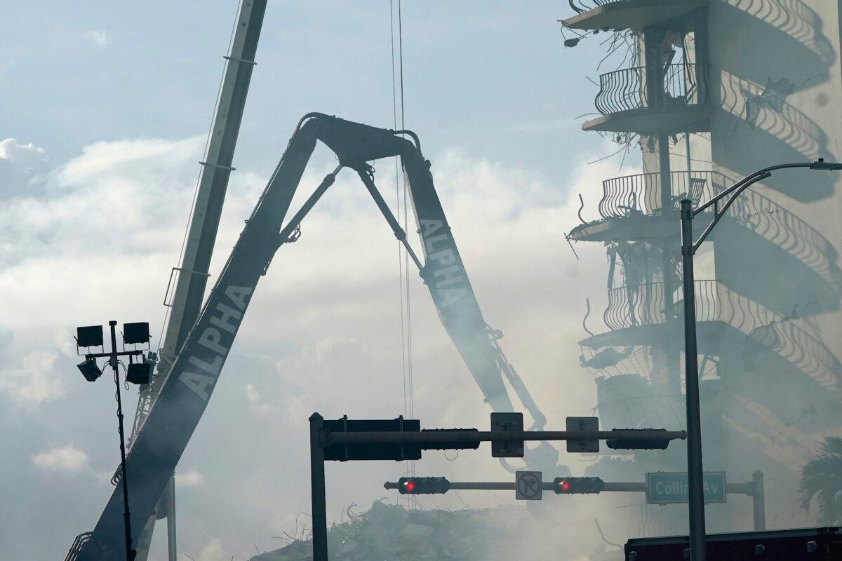 A crane works at the site of the Champlain Towers South Condo building in the Surfside area of Miami, Fla., on June 26, 2021. (Lynne Sladky/AP Photo)