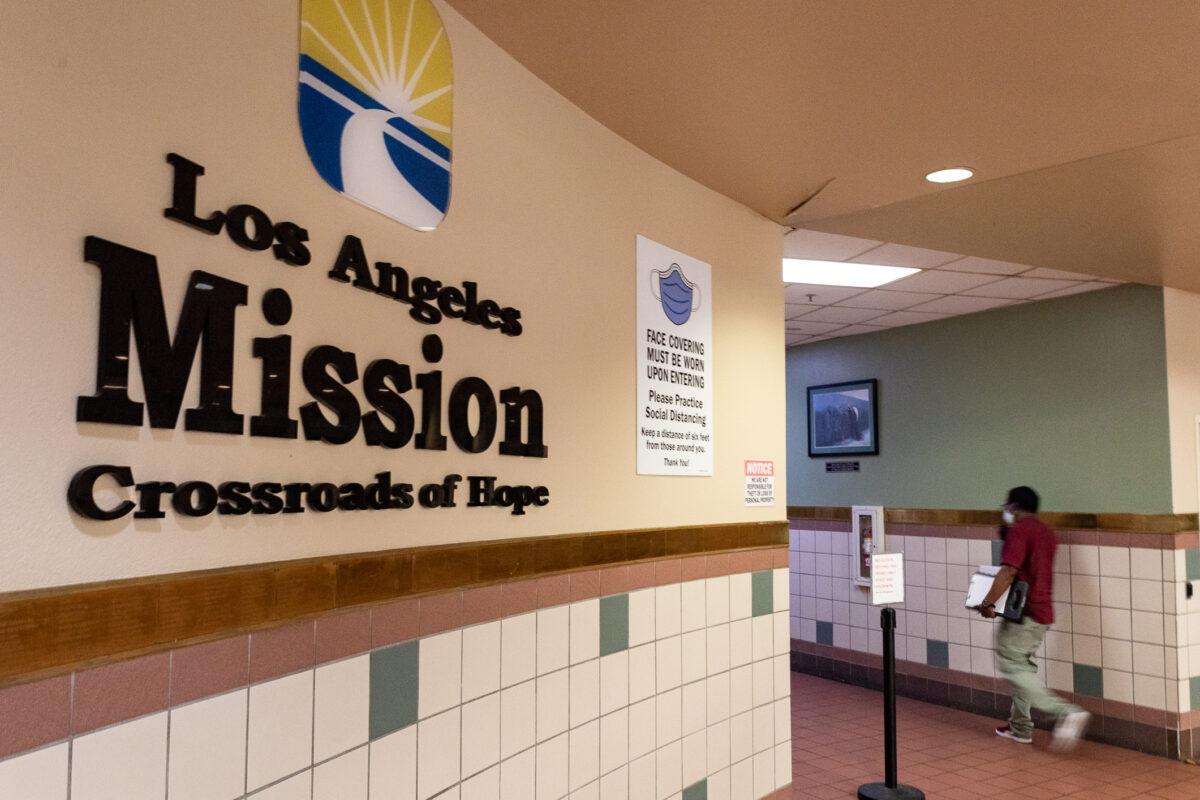 Los Angeles Rescue Mission workers complete day-to-day assignments for Skid Row's homeless community in Los Angeles, on June 9, 2021. (John Fredricks/The Epoch Times)