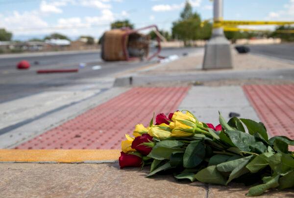 A bouquet of flowers from a mourner is placed near the basket of a hot air balloon which crashed in Albuquerque, N.M., on June 26, 2021. (Andres Leighton/AP Photo)