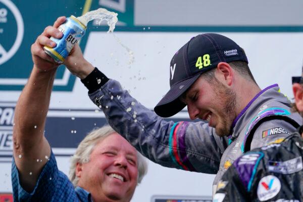 Alex Bowman (R), driver of car 48, celebrates with his crew after winning the NASCAR Cup Series auto race at Pocono Raceway, in Long Pond, Pa., on June 26, 2021. (Matt Slocum/AP Photo)