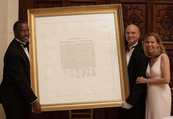 Paul and Sara Fattori at the 2015 auction event, pictured here with Dr. Ben Carson (leftmost). (Courtesy of Fattori Fine Frames)