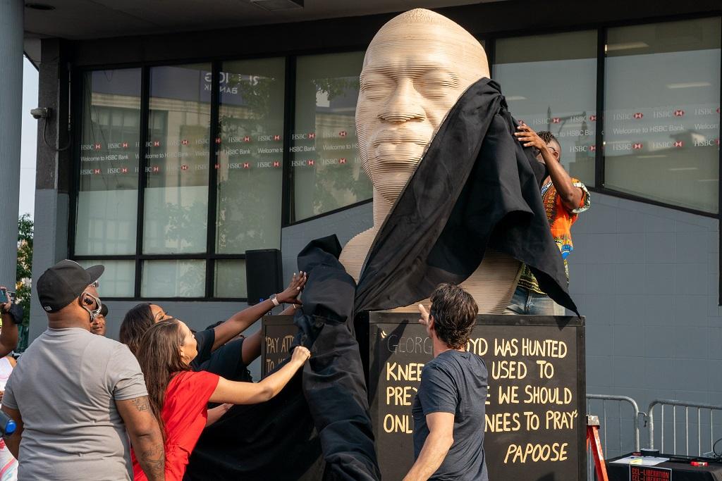 A statue of George Floyd is unveiled at Flatbush Junction in New York City on June 19, 2021. (David Dee Delgado/Getty Images)
