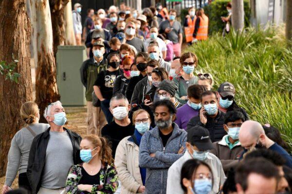 Sydneysiders queue outside a vaccination centre in Sydney, Australia on June 24, 2021. (Saeed Khan/AFP via Getty Images)