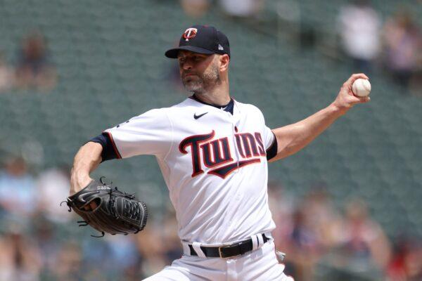 Minnesota Twins' pitcher J.A. Happ throws against the Cleveland Indians during the first inning of a baseball game in Minneapolis, Minn., on June 27, 2021. (Stacy Bengs/AP Photo)