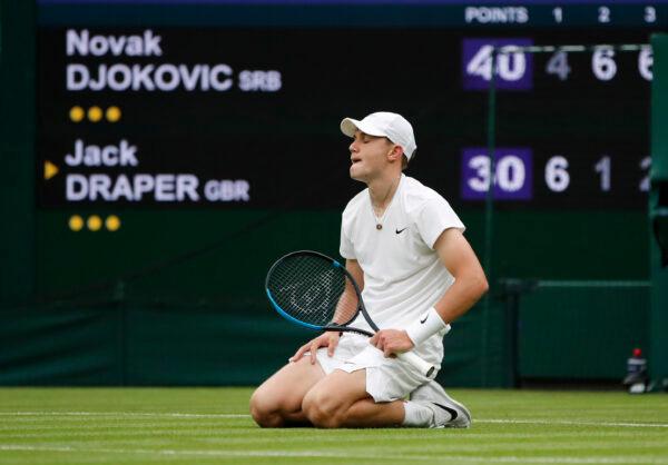Britain's Jack Draper reacts after falling during his first-round match against Serbia's Novak Djokovic at All England Lawn Tennis and Croquet Club in London, on June 28, 2021. (Paul Childs/Reuters)