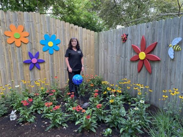 Roxanne Stelle stands in an area of her backyard in Springfield, Illinois, where she planted a monarch butterfly habitat. (Tamara Browning/Radiant Life)