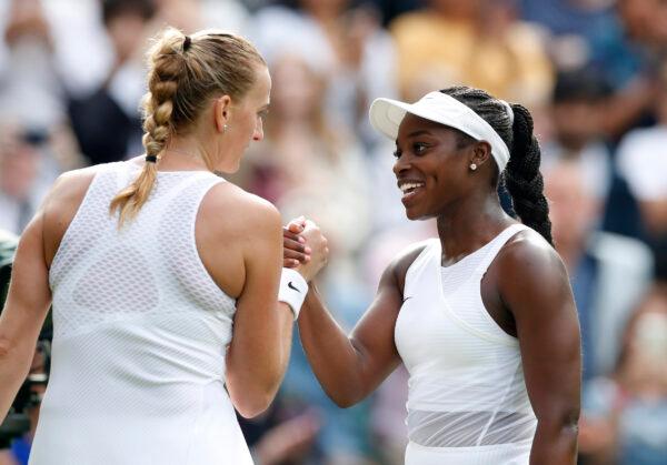 Sloane Stephens of the United States shakes hands with Czech Republic's Petra Kvitova after winning their first round match at All England Lawn Tennis and Croquet Club, London, on June 28, 2021. (Paul Childs/Reuters)