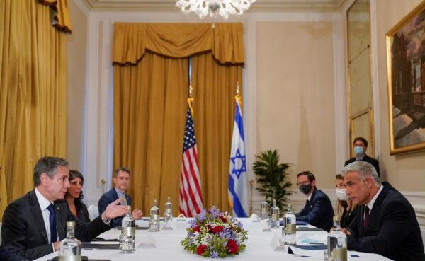 U.S. Secretary of State Antony Blinken meets with Israeli Foreign Minister Yair Lapid in Rome, Italy, on June 27, 2021. (Andrew Harnik/Pool via Reuters)