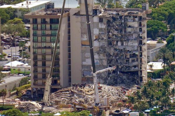 This aerial image shows an oceanfront condo building that partially collapsed on June 24, with many people still unaccounted for, in Surfside, Fla., on June 27, 2021. (Gerald Herbert/AP Photo)