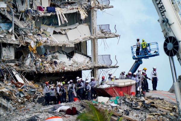 Workers search the rubble at the Champlain Towers South Condo in Surfside, Fla., on June 28, 2021. (Lynne Sladky/(AP Photo)