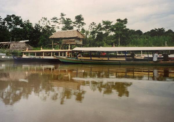 The "cruise ship" on the Tambopata River in Peru turns out to be a large canoe with folding chairs. (Courtesy of Bill Neely)