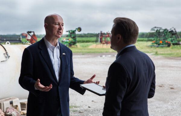 Nebraska Gov. Pete Ricketts (L) talks to Jan Jekielek, host of The Epoch Times's "American Thought Leaders," at a farm south of Lincoln, Neb., on June 24, 2021. (Petr Svab/The Epoch Times)