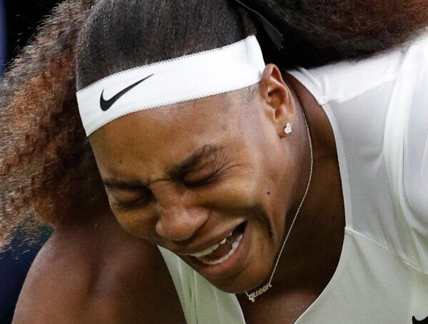 Serena Williams of the United States reacts after sustaining an injury before retiring from her first round match against Belarus' Aliaksandra Sasnovich during The Championships-Wimbledon 2021 at the All England Lawn Tennis and Croquet Club in London, England, on June 29, 2021. (Peter Nicholls/Reuters)