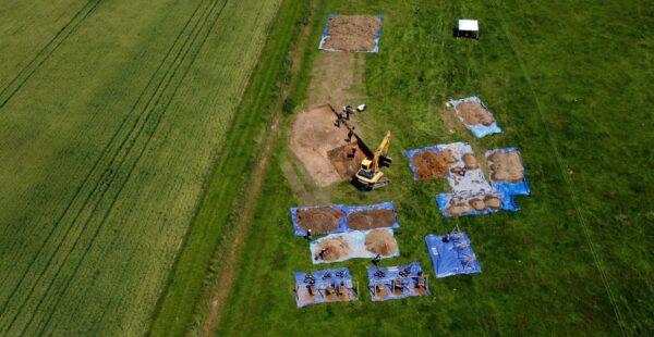 Archaeologists and American Defense POW/MIA Accounting Agency staff work to recover the remains of an American bomber crew, whose aircraft crashed at a site in Arundel in 1944, in Sussex, UK, on June 28, 2021. (Gareth Fuller/PA)