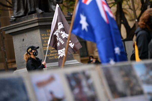 Supporters gather during a Rally for Hong Kong outside the State Library of Victoria in Melbourne, Saturday, June 12, 2021. (AAP Image/James Ross)